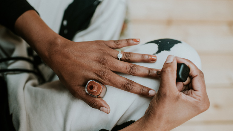 Person applying nail polish