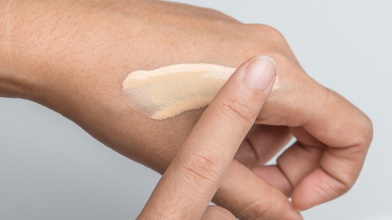 Hand testing tinted moisturizer