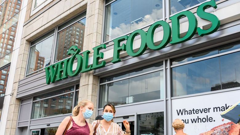 Women walking past Whole Foods