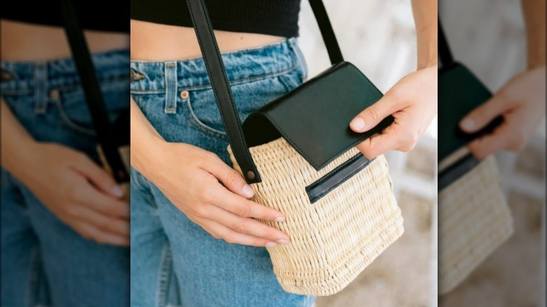 Woven straw and black leather handbag