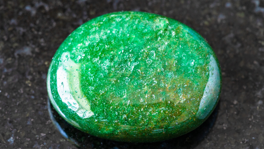 Green aventurine on a granite background 