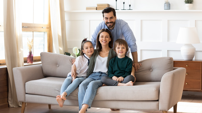 Man, woman, children on couch