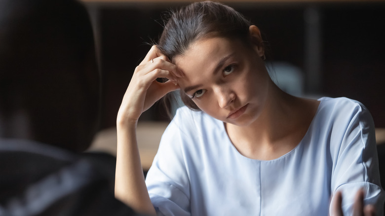 Unhappy woman glaring at date