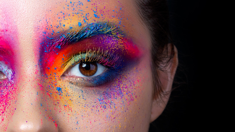 Woman with multi-colored eyeshadow