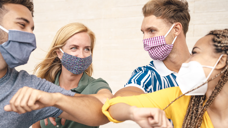 Group of friends wearing masks