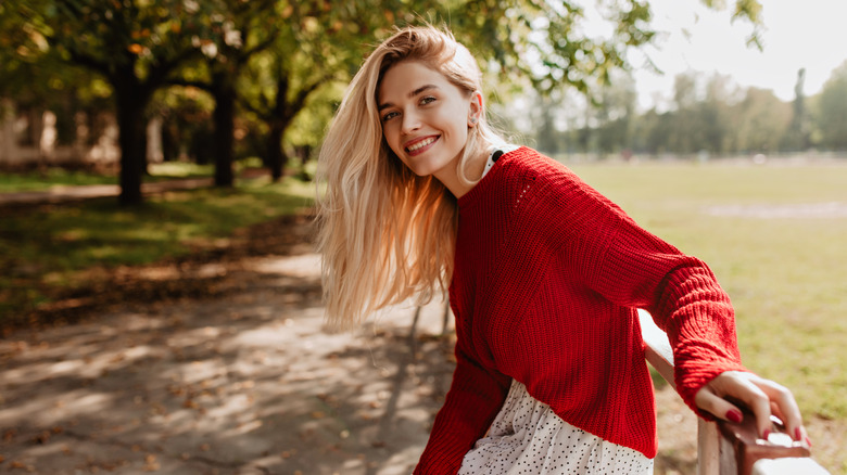 Woman wearing a red cardigan