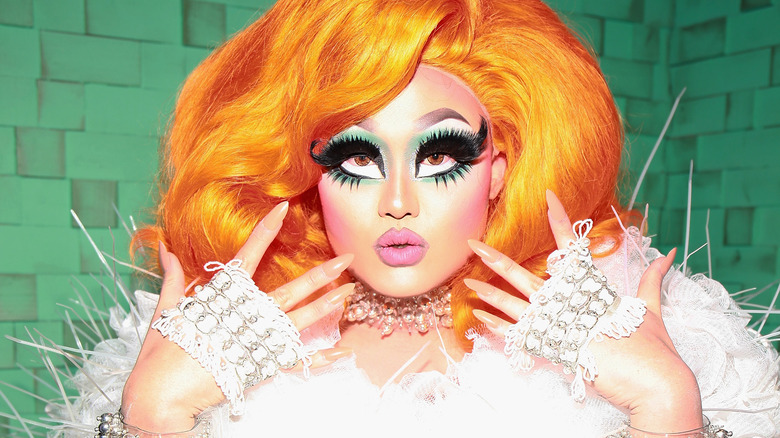 Kim Chi in white and orange