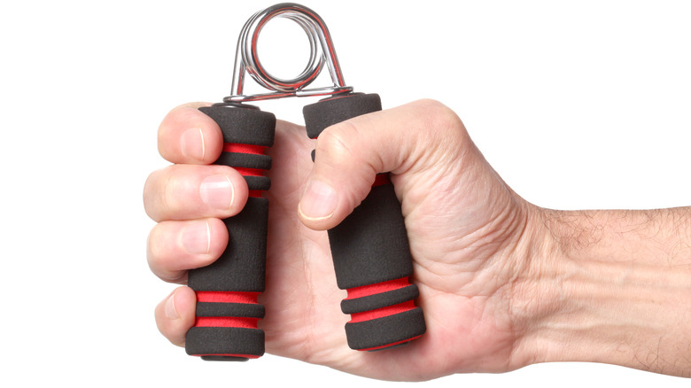 Hand squeezing forearm grip