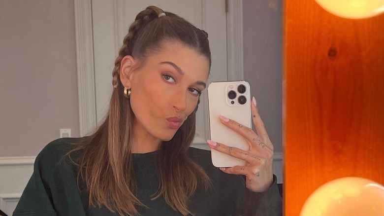 Hailey Bieber taking a selfie