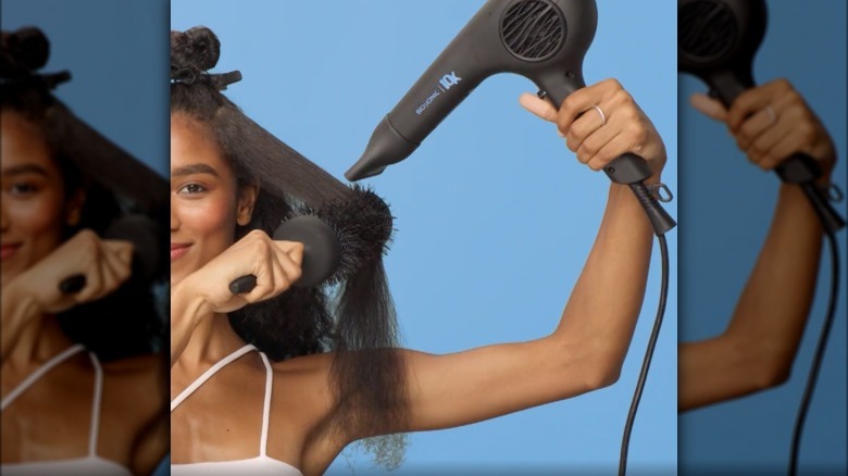 Woman using Bio Ionic Ultralight dryer