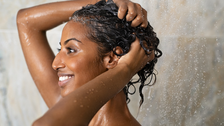 Woman washing hair curly