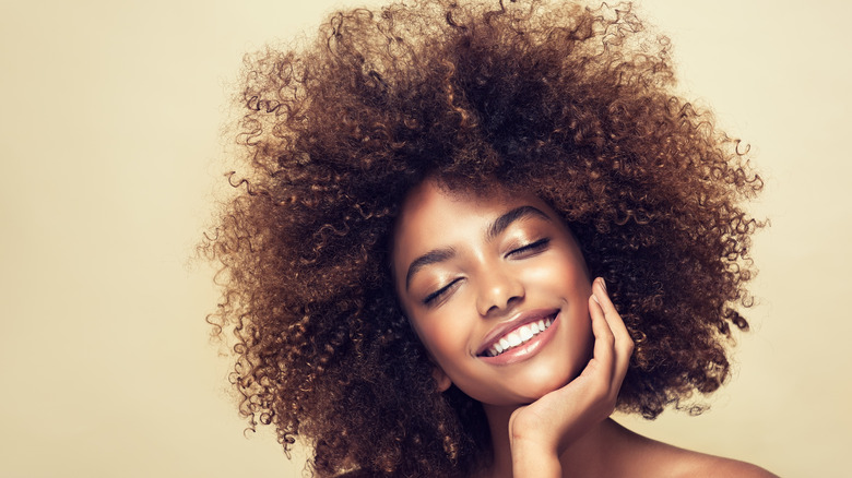 Smiling woman with curly hair