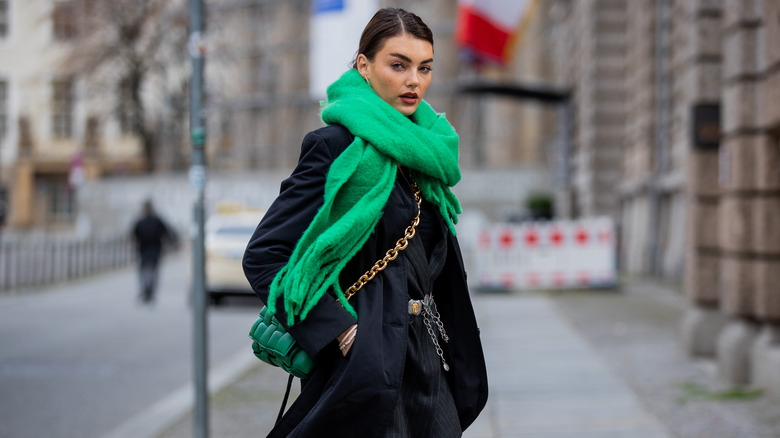 Model wearing black coat