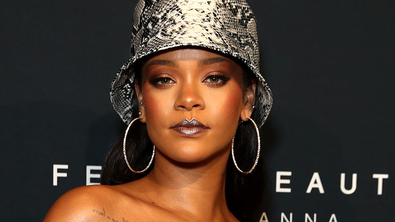 Rihanna showing off the 2020 makeup trend of dark lips