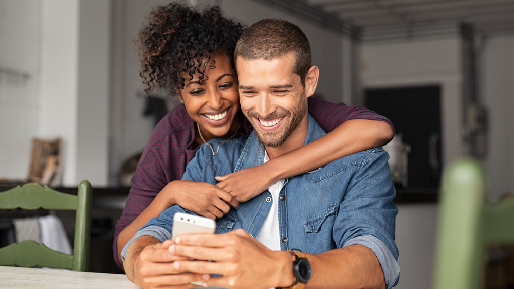 A couple looking at a phone