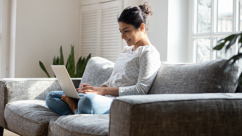 Woman sitting on a couch 