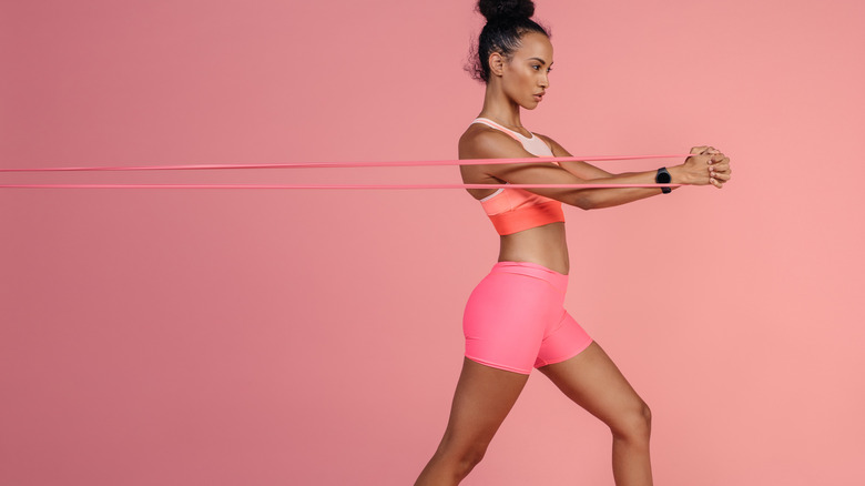 Woman working out with resistance bands