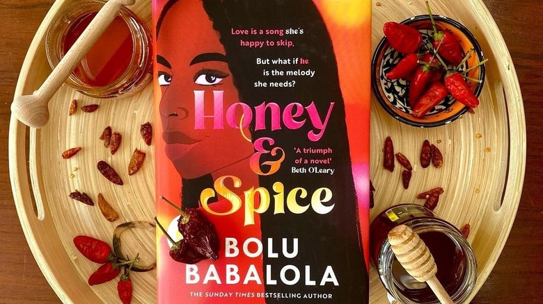 "Honey and Spice" by Bolu Babalola near honey and peppers