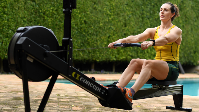 woman rowing outdoors on a concept2 rower