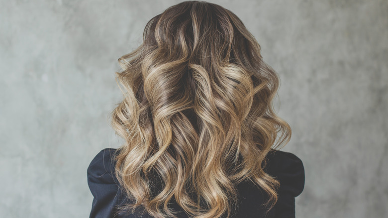 A woman with curly hair 