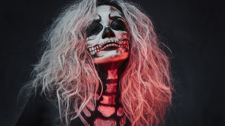 Woman wearing skull makeup