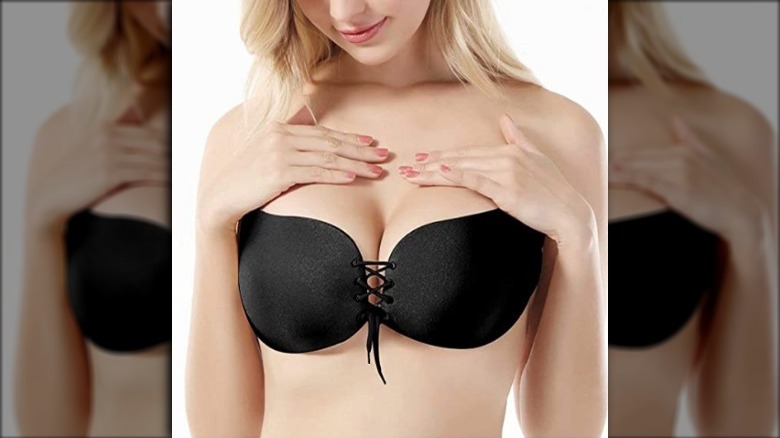 Woman modeling an adhesive strapless bra