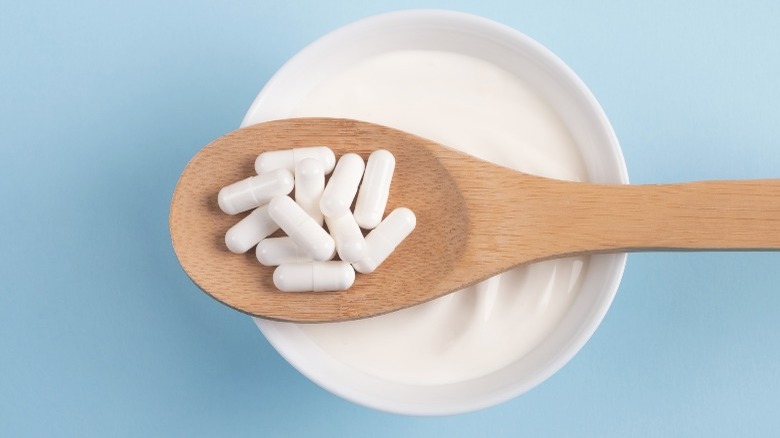 Probiotics on a wooden spoon