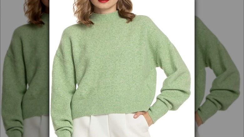 Woman wearing mock neck sweater