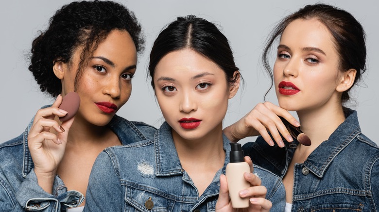 Multiethnic skincare models wearing red lipstick