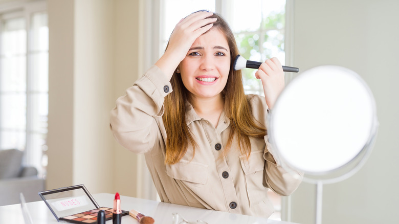 Woman mistakenly applying makeup 