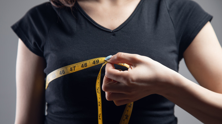 woman with tapemeasure around chest