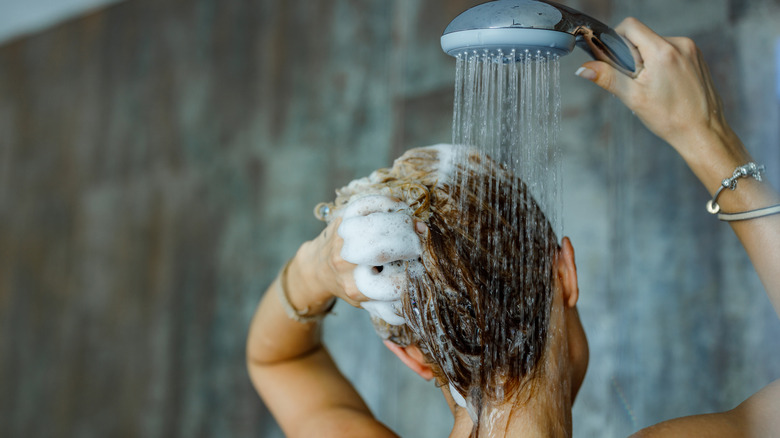 Person washing hair in shower