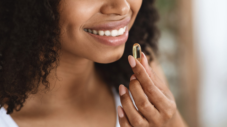 Woman taking vitamins