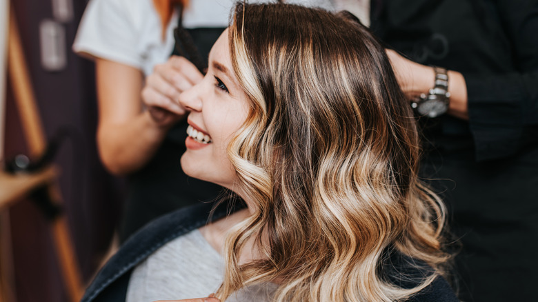 Woman getting highlights done