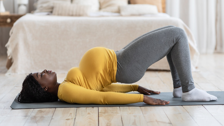 pregnant woman doing yoga