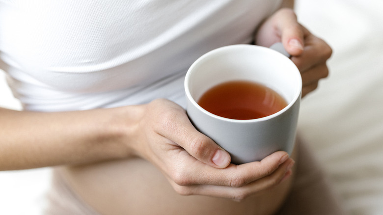 pregnant woman with tea