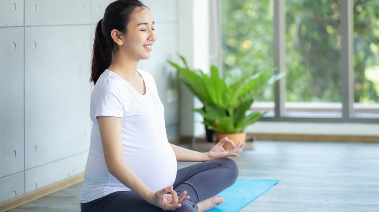 pregnant woman meditating