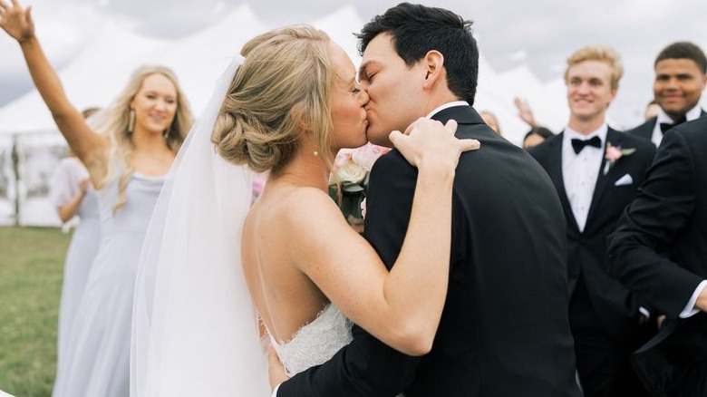 The happy couple, Alex and Mauricio Scott, triumphant after saying their vows