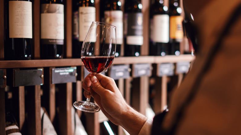 Man holds wine glass