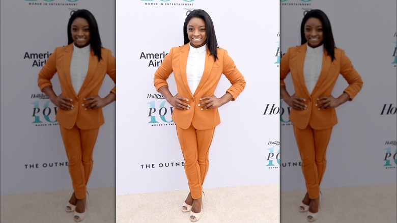 Simone Biles in an orange suit