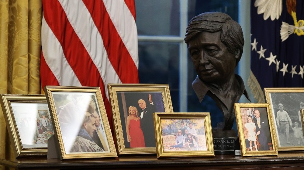 Bust of Cesar Chavez surrounded by family photos