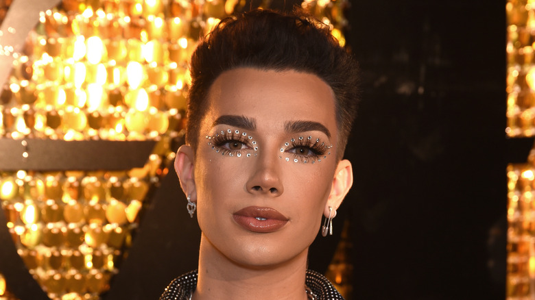 james charles on a gold backdrop