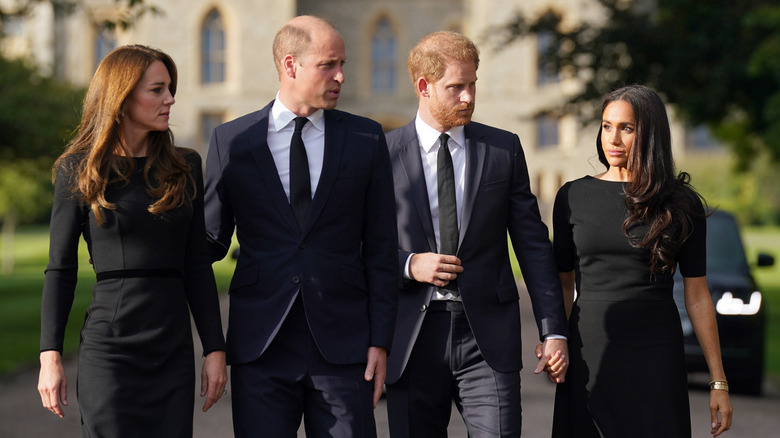 Prince William, Princess Catherine, Prince Harry, and Meghan Markle in black