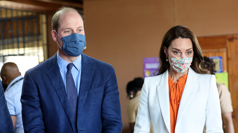 Prince William and Princess Catherine wearing masks