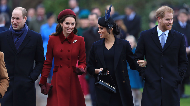 William, Catherine, Meghan, and Harry walking