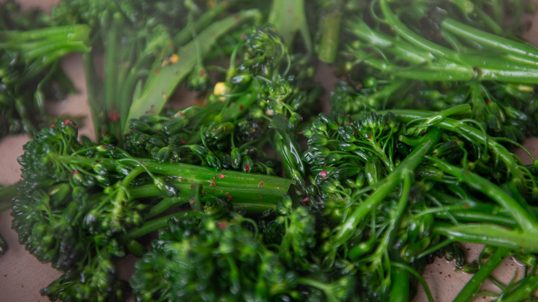 A plate of cooked broccolini