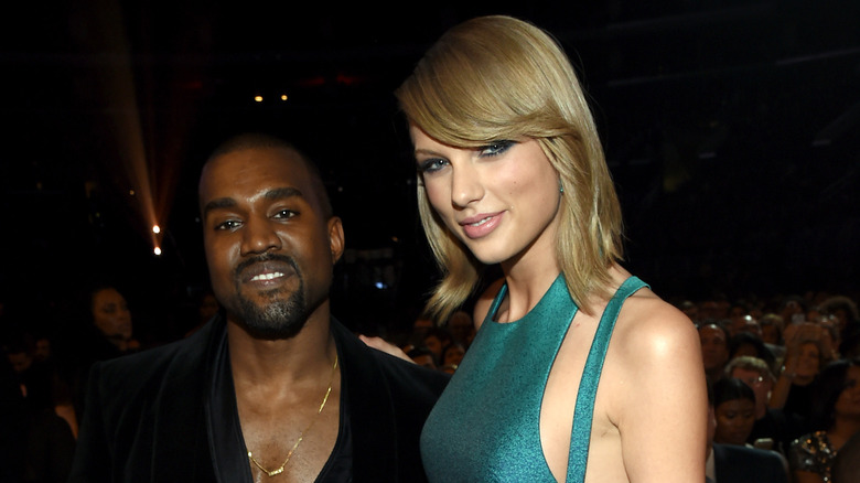 Kanye West and Taylor Swift posing