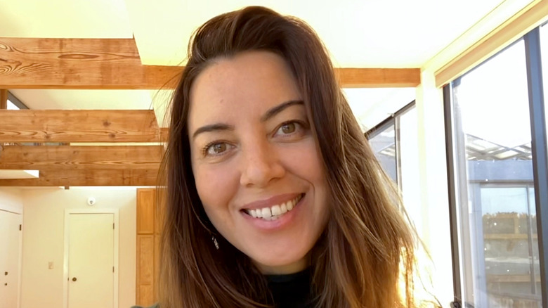 Aubrey Plaza smiling into the camera