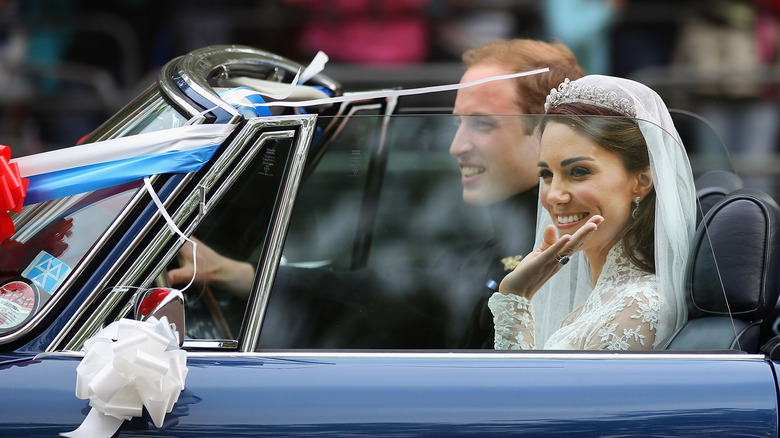 Prince William and Kate Middleton driving a car after their wedding