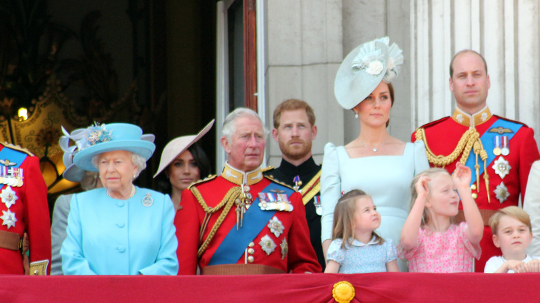 Queen Elizabeth II and the royal family watching procession